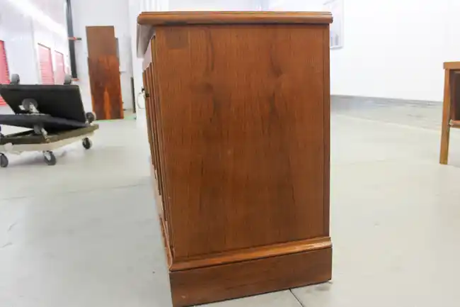 Side angle view of the 4-door wood credenza
