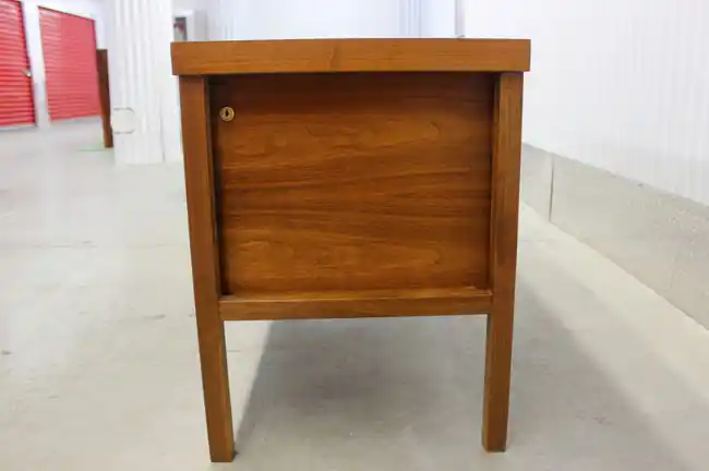 Side view of Lief Jacobsen rosewood credenza showing leg profile