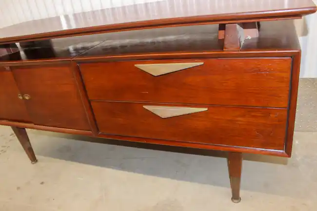 Front view of credenza drawers with mid-century design handles