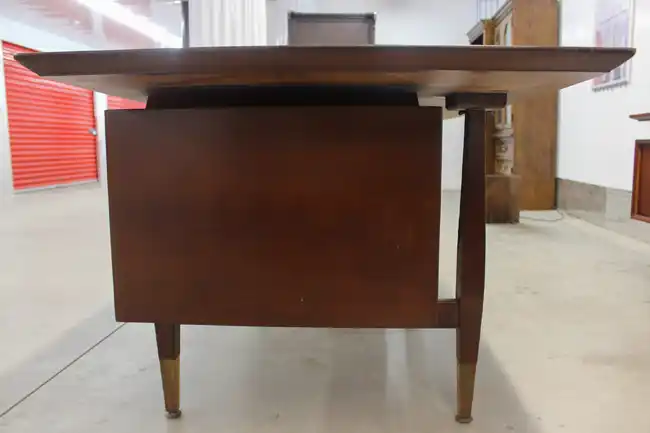 Side profile view of rosewood Scandinavian desk