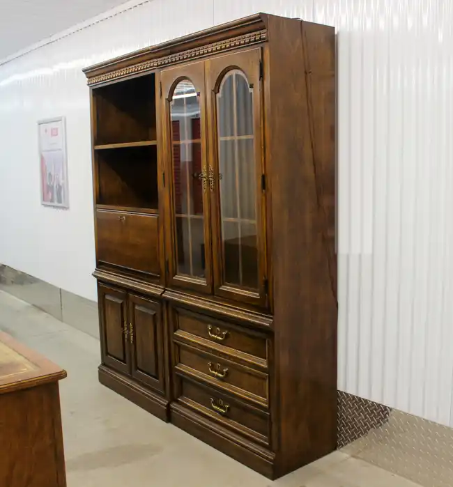 Angled view of vintage Sligh credenza with wood finish
