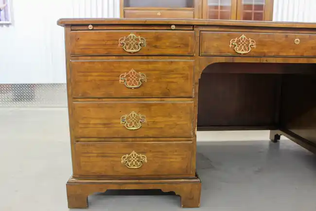 Close-up of drawers and brass handles on Sligh wood desk