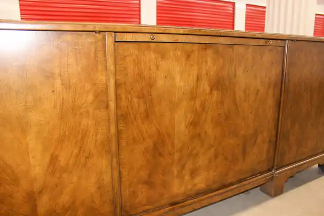 Side panel of Sligh executive desk showing wood grain detail