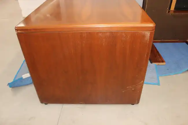 Side angle showing desk overhang and pedestal configuration