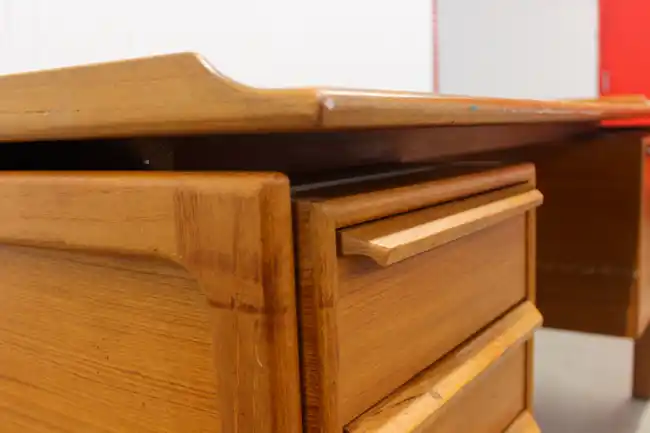 Close-up of drawer handles and restored teak wood surface
