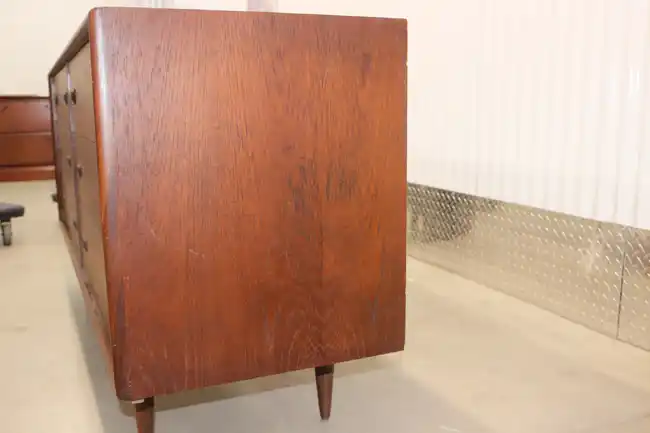 Side view showing depth and grain of teak dresser